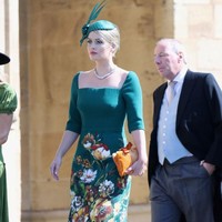 Ia pun tampil sesuai dress-code dengan memakai topi yang senada dengan dress hijaunya.  Foto: dok. Getty Images