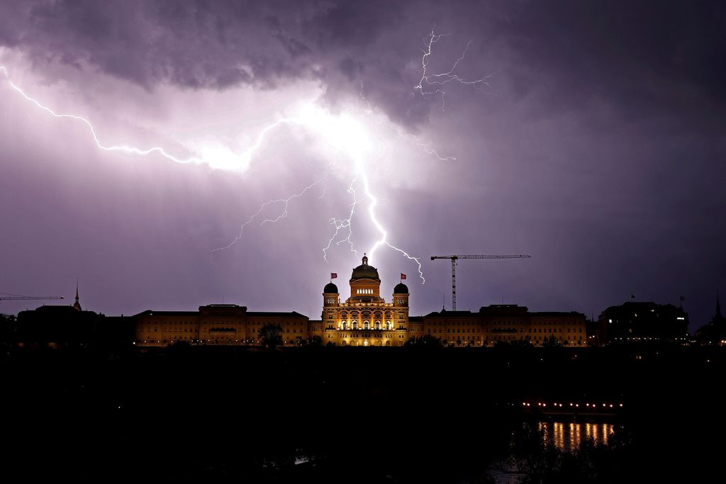 Lightning illuminates the sky above the Swiss Federal Palace (Bundeshaus) in Bern, Switzerland May 27, 2018. Picture taken May 27, 2018.  REUTERS/Stefan Wermuth     TPX IMAGES OF THE DAY