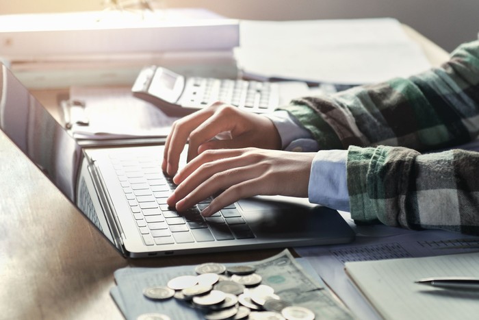 businesswoman working on desk with using laptop. concept finance and accounting