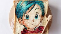 Pasti tau dong gambar tokoh kartun apa yang digambar Bell? Ya Bulma di film Dragon Ball! Ia sengaja membuat roti panggang ini untuk memperingati kematian dubber Bulma, Hiromi Tsuru. Foto: Instagram bellchan_cooking_bento