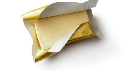 Butter cream Icing being made by mixing butter and icing sugar, part of making a cake series