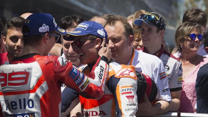 JEREZ DE LA FRONTERA, SPAIN - MAY 07:  Marc Marquez of Spain and Repsol Honda Team celebrate with Jorge Lorenzo of Spain and Ducati Team  (L) under the podium at the end of the MotoGP race during the MotoGp of Spain - Race at Circuito de Jerez on May 7, 2017 in Jerez de la Frontera, Spain.  (Photo by Mirco Lazzari gp/Getty Images)