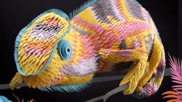 Karya seni Lloyd lainnya, yaitu kerajinan kertas berbentuk iguana. Pemilihan warna-warna cerah yang digunakan Lloyd membuat iguana tersebut menjadi lebih ceria dan menggemaskan. Istimewa/Boredpanda.