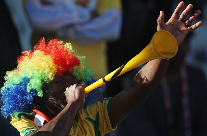 BLOEMFONTEIN, SOUTH AFRICA - JUNE 27: A football fan blows a vuvuzela prior to the 2010 FIFA World Cup South Africa Round of Sixteen match between Germany and England at Free State Stadium on June 27, 2010 in Bloemfontein, South Africa.  (Photo by Joern Pollex/Getty Images)