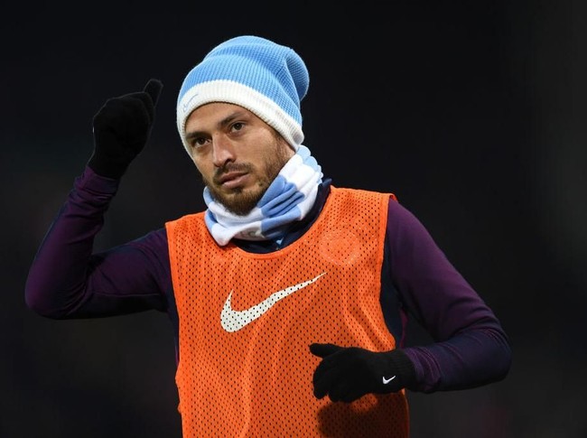 Spanyol punya banyak pemain ganteng dan David Silva adalah salah satunya. Bertubuh atletis dan dengan lesung pipinya yang semakin terlihat ketika dia tersenyum, David sungguh bisa membuat wanita gagal fokus di Piala Dunia 2018. (Foto: Getty Images)