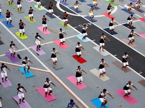 Members of the Indian Navy perform yoga on the flight deck of INS Viraat, an Indian Navy decommissioned aircraft carrier, during International Yoga Day in Mumbai, India, June 21, 2018. REUTERS/Francis Mascarenhas