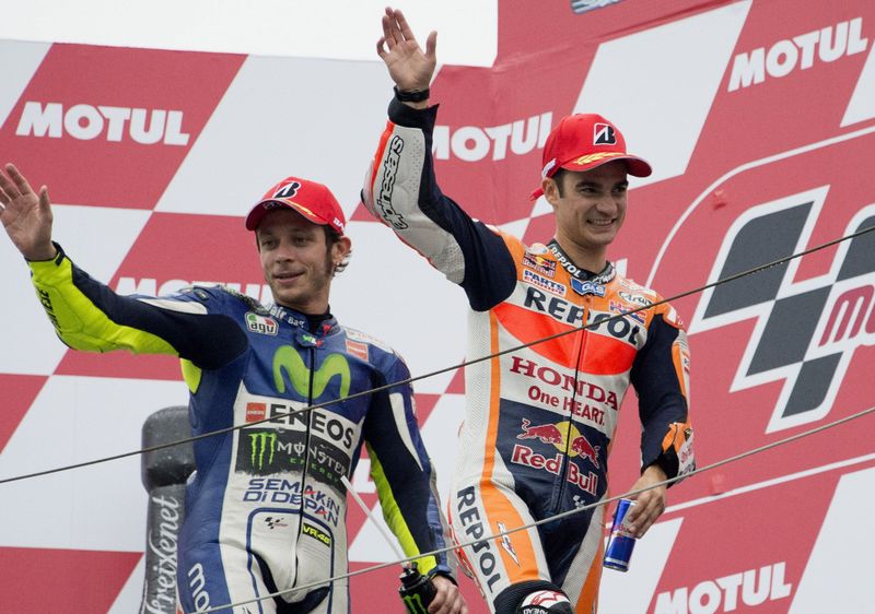 MOTEGI, JAPAN - OCTOBER 11:  Dani Pedrosa of Spain and Repsol Honda Team celebrates with Valentino Rossi of Italy and Movistar Yamaha MotoGP (L) on the podium at the end of the MotoGP race during the MotoGP Of  Japan - Race at Twin Ring Motegi on October 11, 2015 in Motegi, Japan.  (Photo by Mirco Lazzari gp/Getty Images)