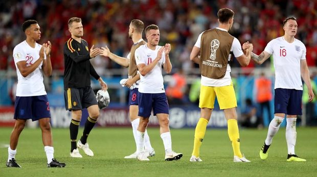   The England team plays a number of lining players against Belgium. 