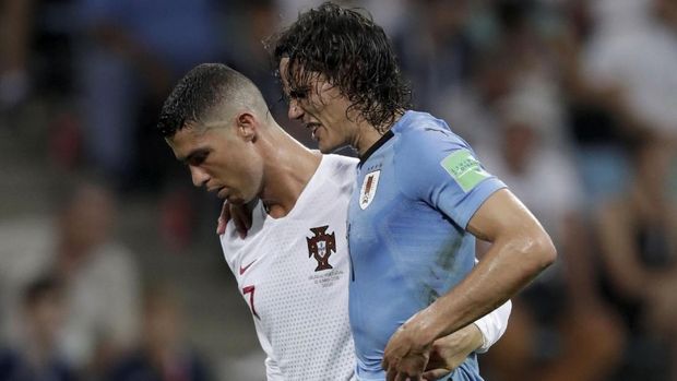   Edinson Cavani scored twice to lead Uruguay to victory against Portugal. 