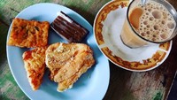 @yaumil_djroeh dari Aceh menikmati kopi di Jembatan Kopi. Kopi sanger plus pisang goreng, bka dan kue lapis. Bekal memulai pagi yang mantap nih! Foto: Instagram @yaumil_djroeh