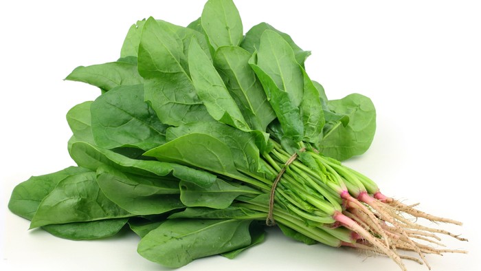 Bunch spinach on white