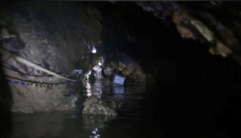 Rescue personnel work at the Tham Luang cave complex in the northern province of Chiang Rai,ÊThailand July, 2018 in this still image taken from a video obtained from social media. THAI NAVY SEAL/via REUTERS THIS IMAGE HAS BEEN SUPPLIED BY A THIRD PARTY. MANDATORY CREDIT. NO RESALES. NO ARCHIVES.