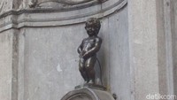 Foto: Bicara ikon wisata Belgia, inilah Patung Bocah Pipis, Manneken Pis yang terkenal seantero dunia. Meski wujudnya kecil, tapi ribuan turis datang untuk melihatnya. (Fitraya/detikTravel)