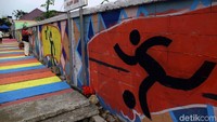 Mural tersebut mengajak warga untuk menyemarakan olahraga dan Asian Games.