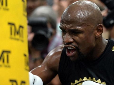 Aug 10, 2017; Las Vegas, NV, USA; Floyd Mayweather Jr. hits a heavy bag during a media workout in preparation for his fight against Conor McGregor at Mayweather Boxing Club. Mandatory Credit: Joe Camporeale-USA TODAY Sports