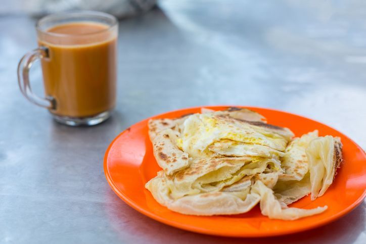Roti canai food indea style and Milk tea for breakfast.