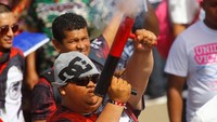 Puluhan ribu orang berkumpul di lapangan umum di dekat Danau Managua untuk mendengar Ortega dan yang lainnya berbicara saat unjuk rasa memperingati kejatuhan kediktatoran Somoza. Oswaldo Rivas/Reuters.