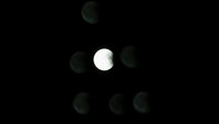 Bulan dilihat melalui dua lapisan kaca berlapis ganda pada saat-saat terakhir gerhana bulan di atas Kappara, Malta 27 Juli 2018. REUTERS / Darrin Zammit Lupi