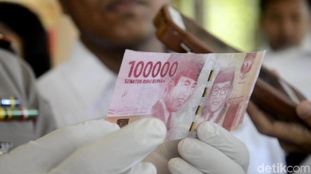 uang palsu pecahan 100 ribuan