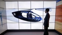 Taksi terbang ini bisa take off dan landing secara vertikal seperti helikopter. Taksi terbang akan menerapkan teknologi hybrid, perpaduan antara bahan bakar gas dan listrik. (AFP/Getty Images)