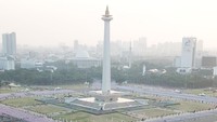 Kostum senam poco-poco berwarna merah-putih dikenakan Jokowi di acara ini (Foto: Akbar Nugroho Gumay/Antara Foto)