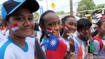 Foto: Anak Sekolah Ibu Kota Ramaikan Pawai Obor Asian Games