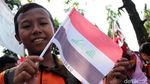 Foto: Anak Sekolah Ibu Kota Ramaikan Pawai Obor Asian Games