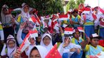Foto: Anak Sekolah Ibu Kota Ramaikan Pawai Obor Asian Games