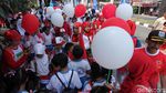 Foto: Anak Sekolah Ibu Kota Ramaikan Pawai Obor Asian Games