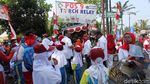 Foto: Anak Sekolah Ibu Kota Ramaikan Pawai Obor Asian Games