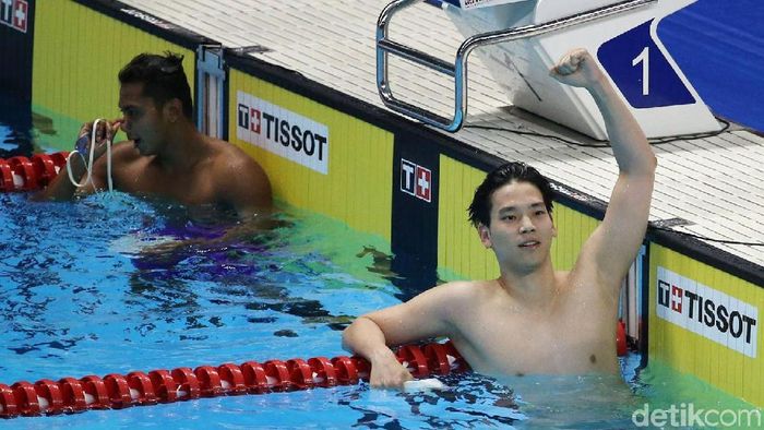 Perenang China Jiayu Xu memenangi cabang renang nomor 100 meter gaya punggung Asian Games 2018, Minggu (19/8/2018). (Foto: Grandyos Zafna/detikSport) Perenang China Jiayu Xu memenangi cabang renang nomor 100 meter gaya punggung Asian Games 2018, Minggu (19/8/2018). (Foto: Grandyos Zafna/detikSport)