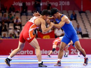 Mantap! Pegulat Indonesia Muhammad Aliansyah Melaju ke Perempatfinal