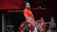 Triyatno bertanding di kelas 69 kg cabang angkat besi Asian Games 2018 yang berlangsung di Hall A JIExpo Kemayoran, Jakarta Pusat, Rabu (22/8/2018).