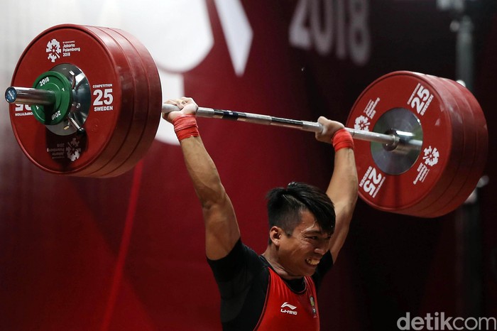 Lifter Indonesia Deni berhasil menjadi peringkat I grup B cabang angkat besi kelas 69 kg putra dengan total angkatan 318 kg.