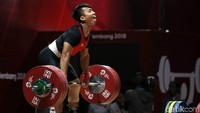 Deni tampil di cabang angkat besi kelas 69 kg di JIExpo Kemayoran, Jakarta Pusat, Rabu (22/8/2018).