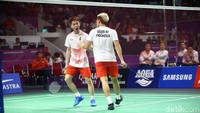Kevin/Marcus merayakan kemenangan.