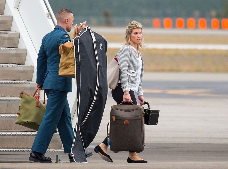ASSAM, INDIA - APRIL 12: The Duchess of Cambridge's PA and Stylist Natasha Archer carries items of luggage as she arrives at Tezpur Airport on April 12, 2016 in Assam, India. The Duke and Duchess of Cambridge are on a week-long tour of India and Bhutan taking in Mumbai, Delhi, Assam, Bhutan and Agra. (Photo by Dominic Lipinski - Pool/Getty Images)