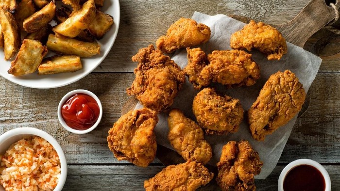 Delicious homemade crispy fried chicken with taters and coleslaw.