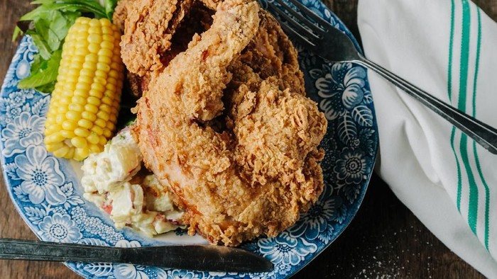 Delicious homemade crispy fried chicken with taters and coleslaw.