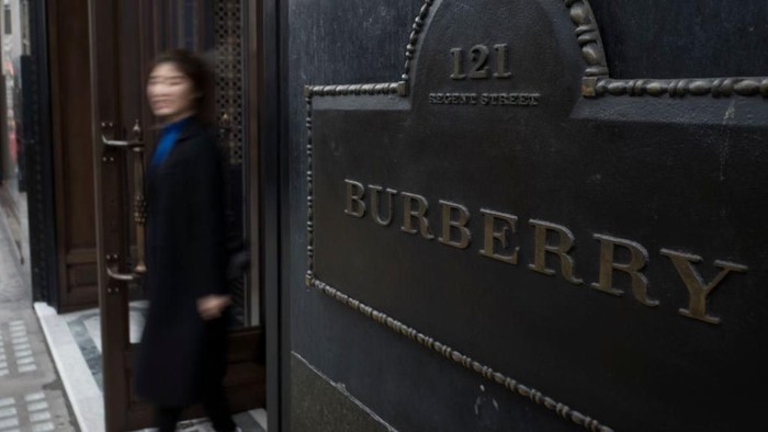 LONDON, ENGLAND - JANUARY 08:  A model walks the runway at the Burberry AW14 Menswear Show at Kensington Gardens on January 8, 2014 in London, England.  (Photo by Anthony Harvey/Getty Images)