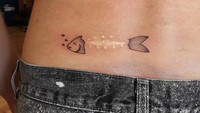Bekas jahitan memberikan pola yang cocok untuk jadi tato tulang ikan. (Foto: Instagram/prezes27)