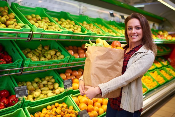 178591109 Woman making salad in kitchen. Healthy eating lifestyle concept with beautiful young woman cooking in her kitchen. See more: