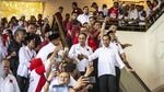 Saat Jokowi Semangati Relawan dan Prabowo Temui Ulama