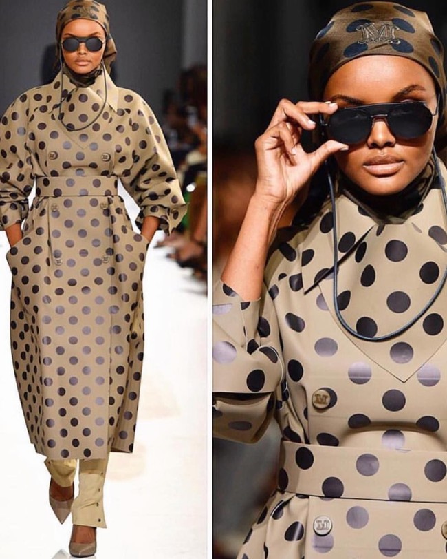 Melenggang bersama model kenamaan Gigi Hadid, Halima tampil fierce di panggung tersebut. Ia mengenakan coat berpotongan oversized dengan motif polkadot. Corak tersebut bukanlah hasil printing, melainkan corak bertekstur yang dibuat dengan detail oleh Ian Griffiths, desainer Max Mara. (Foto: Dok. Vogue)