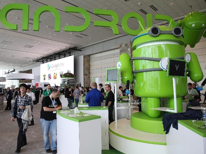 SAN FRANCISCO, CA - MAY 15:  Attendees visit the Android booth during the Google I/O developers conference at the Moscone Center on May 15, 2013 in San Francisco, California. Thousands are expected to attend the 2013 Google I/O developers conference that runs through May 17. At the close of the markets today Google shares were at all-time record high at $916 a share, up 3.3 percent.  (Photo by Justin Sullivan/Getty Images)