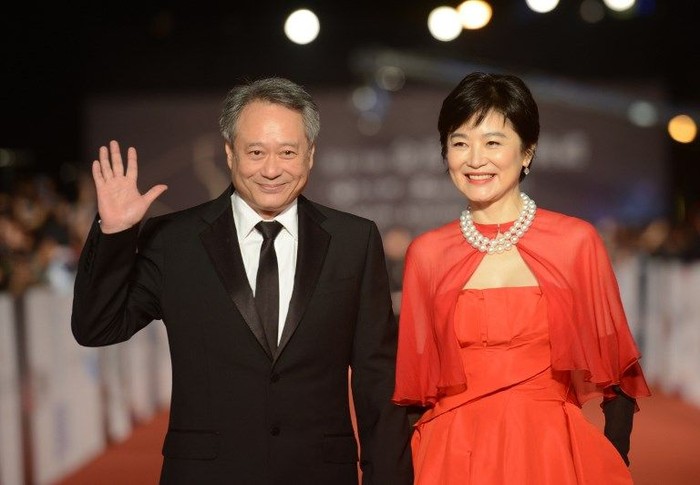 Taiwan actress Lin Ching-hsia (R) and director Ang Lee arrive ahead of the Golden Horse Film Awards in Taipei, on November 23, 2013.  Stars from China, Hong Kong, Singapore and Taiwan are gathering in Taipei for this years Golden Horse Film Awards, dubbed the 