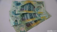 Penampakan salah satu mata uang Kina.