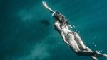 Potret Gaya Liburan Model Seksi yang Juga Stuntwoman