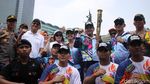 Kemeriahan Pawai Obor Asian Para Games 2018 di CFD