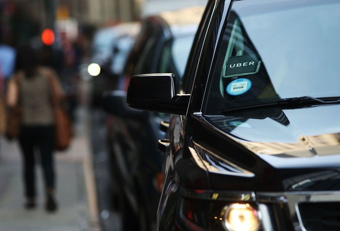 NEW YORK, NY - JUNE 14:  An Uber SUV waits for a client in Manhattan a day after it was announced that Uber co-founder Travis Kalanick will take a leave of absence as chief executive on June 14, 2017 in New York City. The move came after former attorney general Eric H. Holder Jr. and his law firm, Covington & Burling, released 13 pages of recommendations compiled as part of an investigation of sexual harassment at the ride-hailing car service.  (Photo by Spencer Platt/Getty Images)